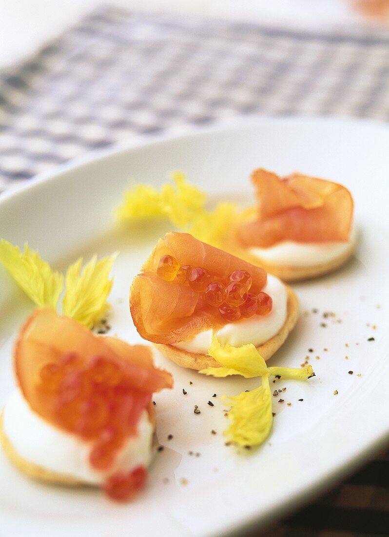 Blinis with sour cream, salmon and caviar