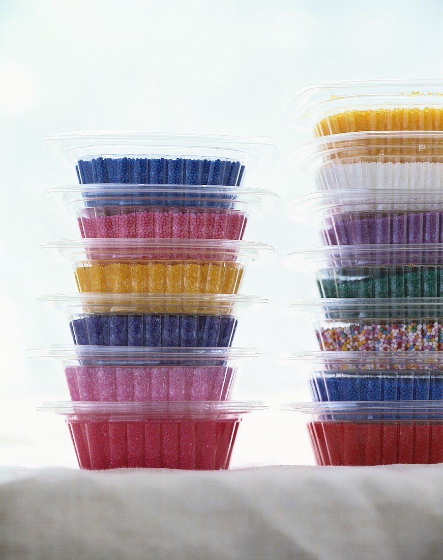 Coloured sugar in plastic containers
