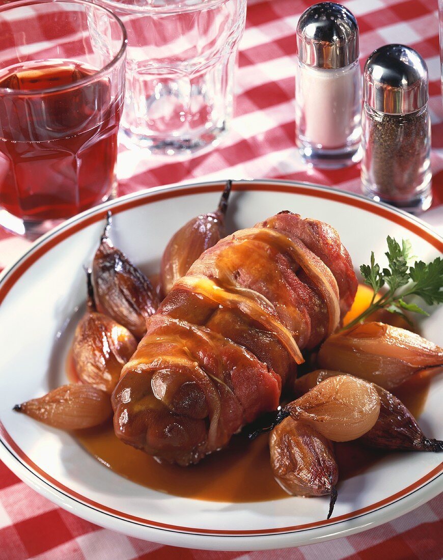 Veal kidneys wrapped in bacon with shallots