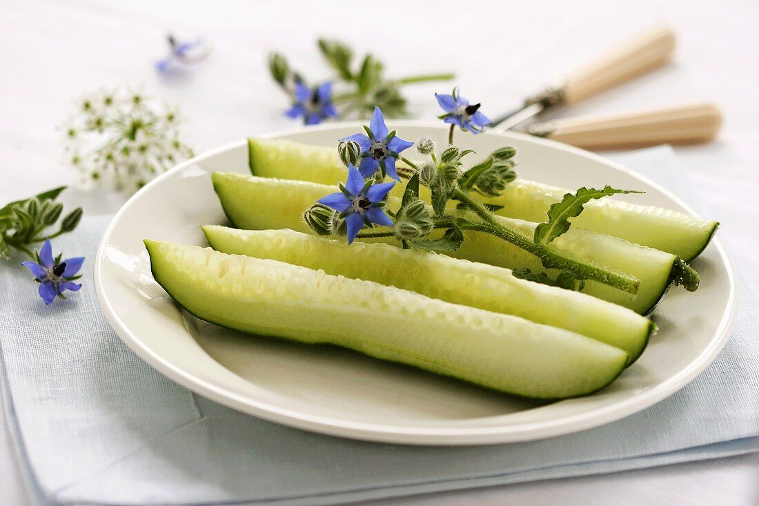 Strips of cucumber with borage flowers