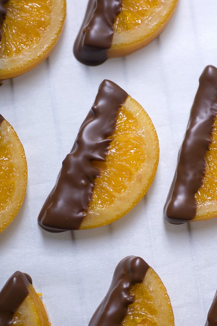 Half orange slices dipped in chocolate