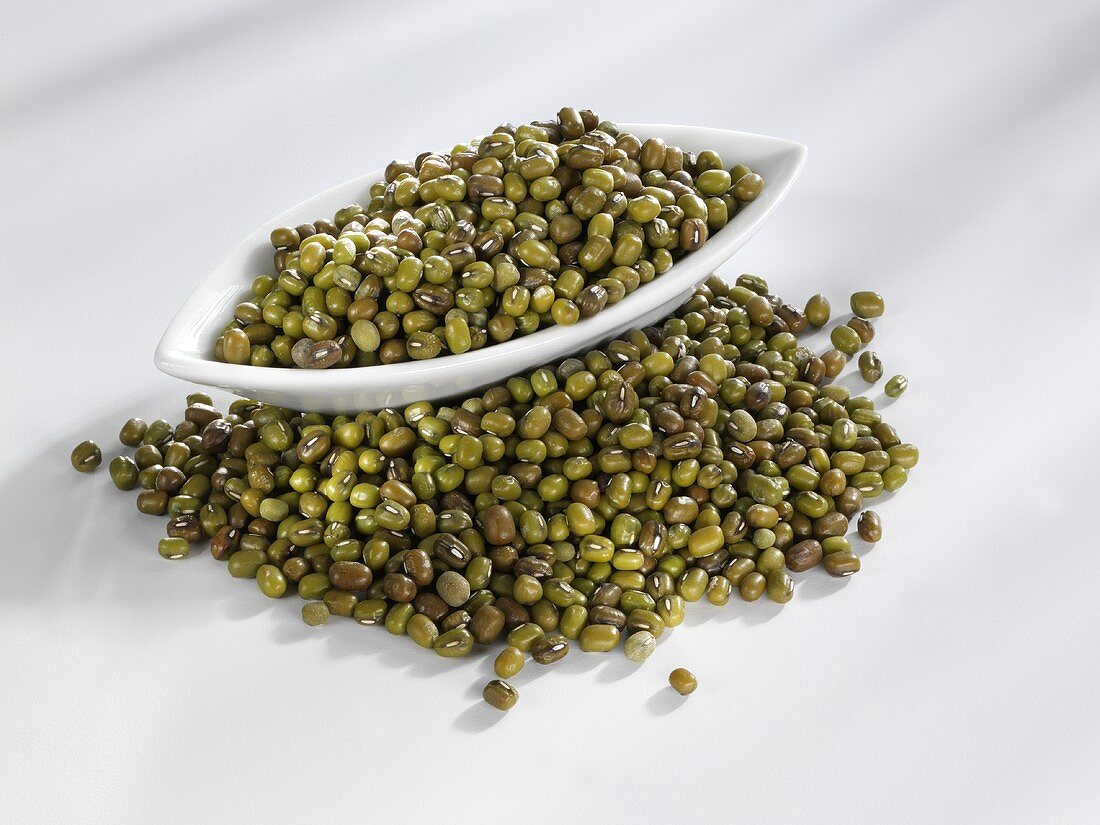 Mung beans in and beside a bowl