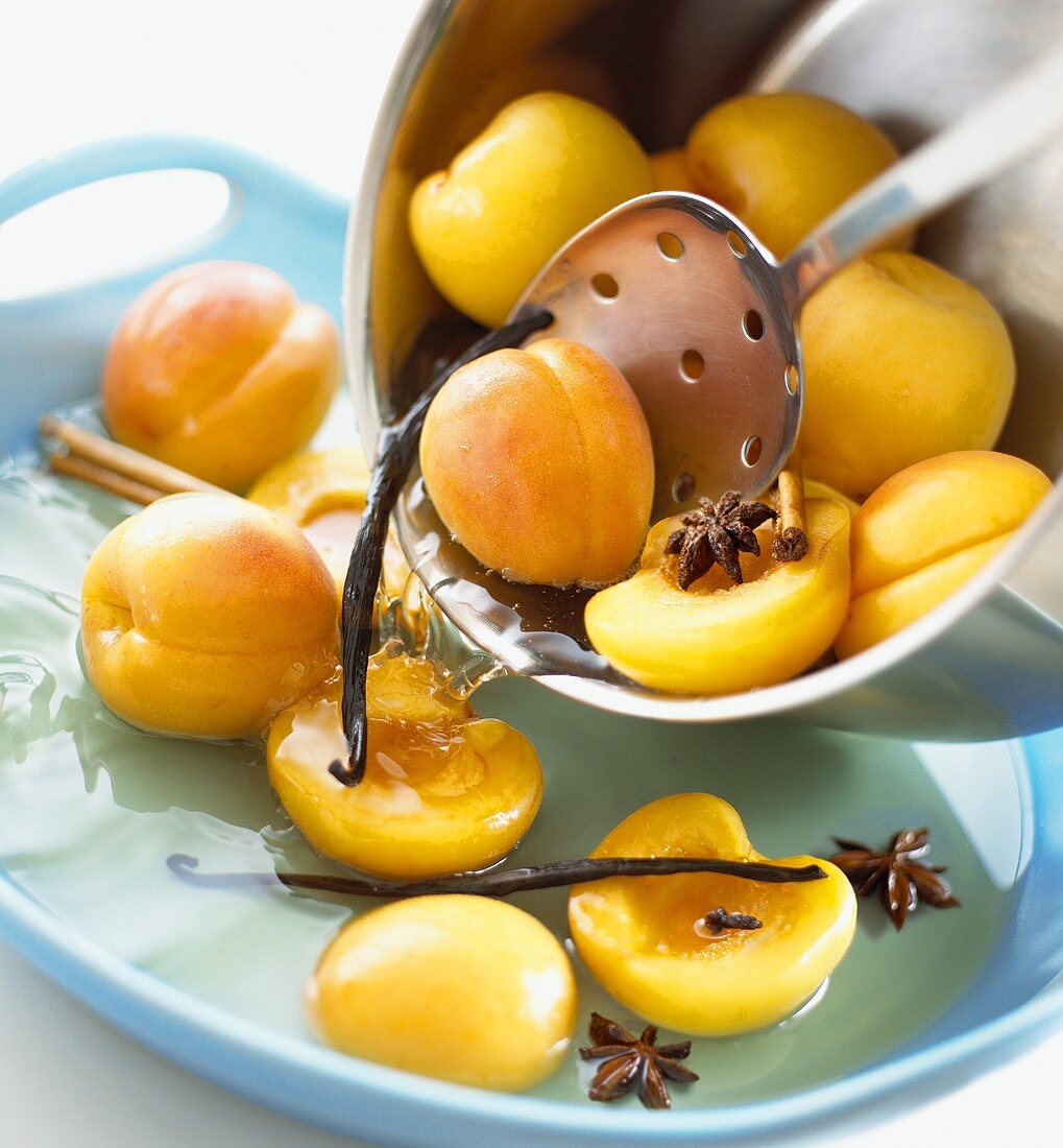 Putting poached peaches into a bowl