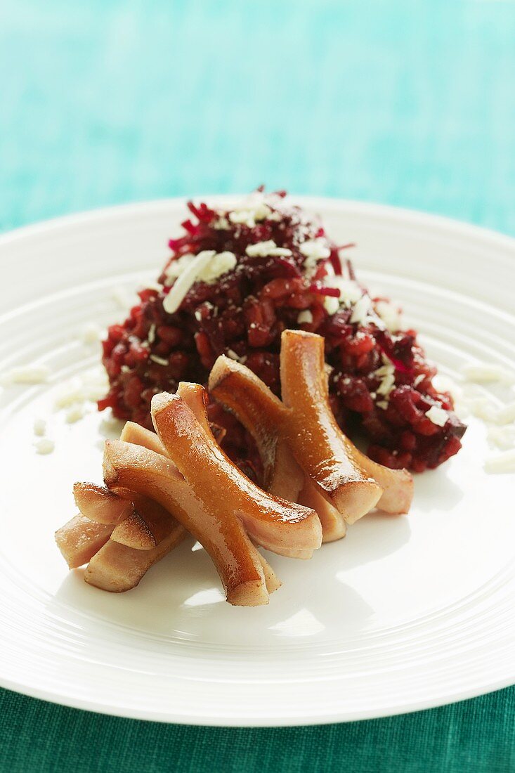 Sausages with beetroot risotto and Parmesan