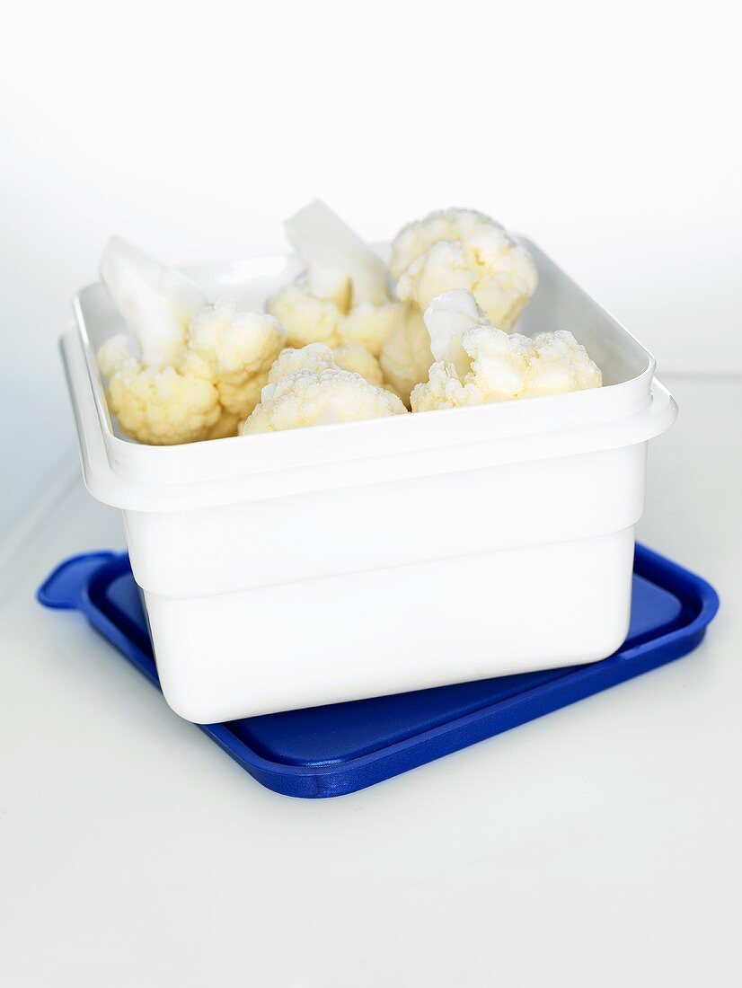 Frozen cauliflower in a plastic box