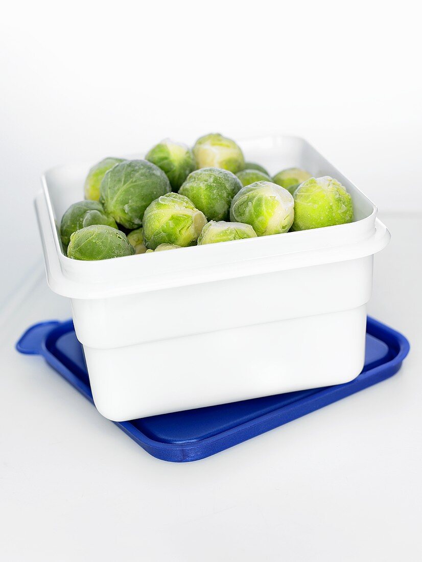 Frozen Brussels sprouts in a plastic box