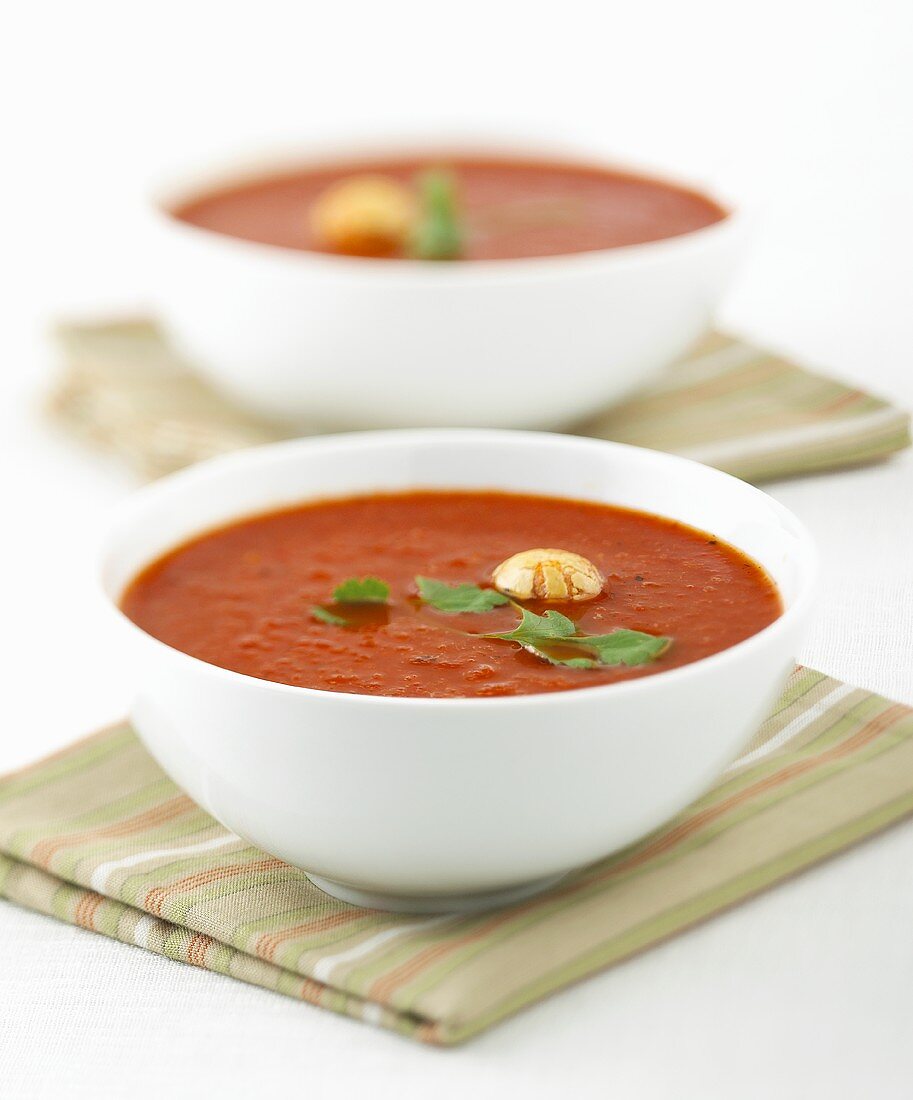 Two bowls of tomato soup