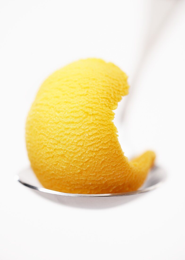 Mango sorbet on a spoon