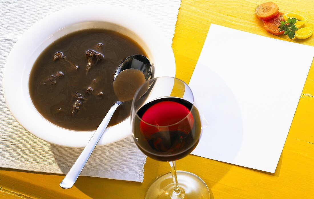 Oxtail soup and a glass of red wine