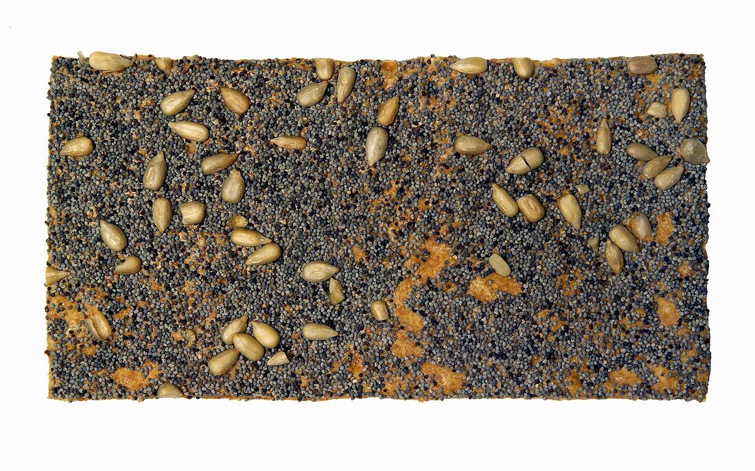 A slice of crispbread with poppy seeds and sunflower seeds