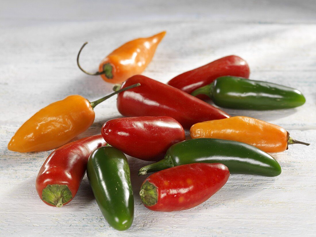 Red, green and orange chillies