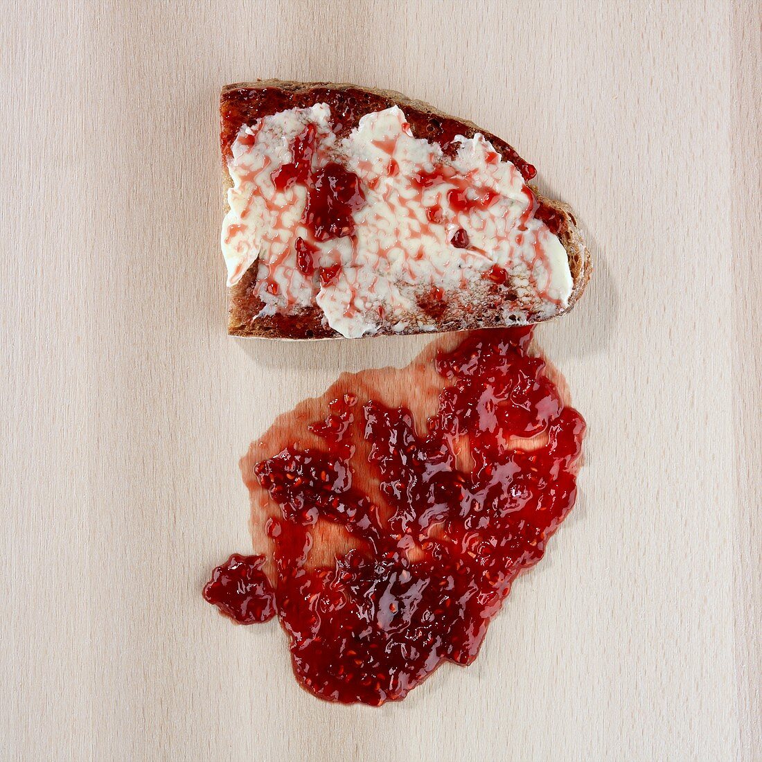 Jam and bread, dropped on the floor