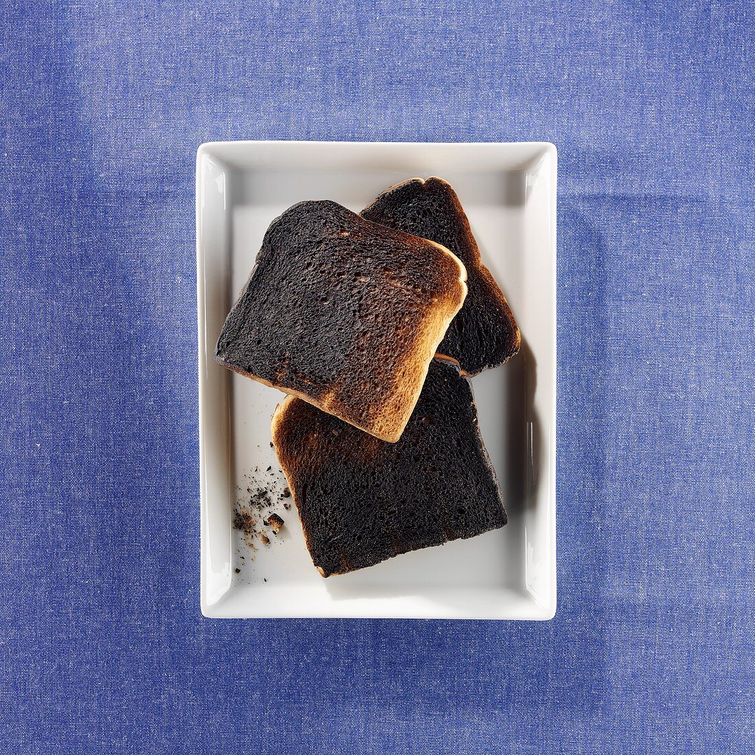 Three slices of burnt toast