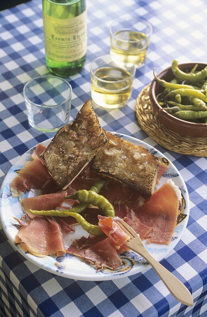 Ham platter with garlic baguette and chillies