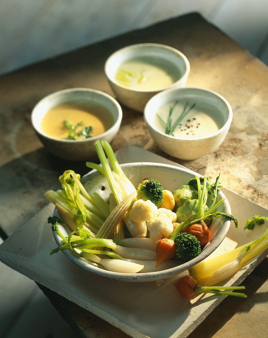 Steamed vegetables with three cheese sauces