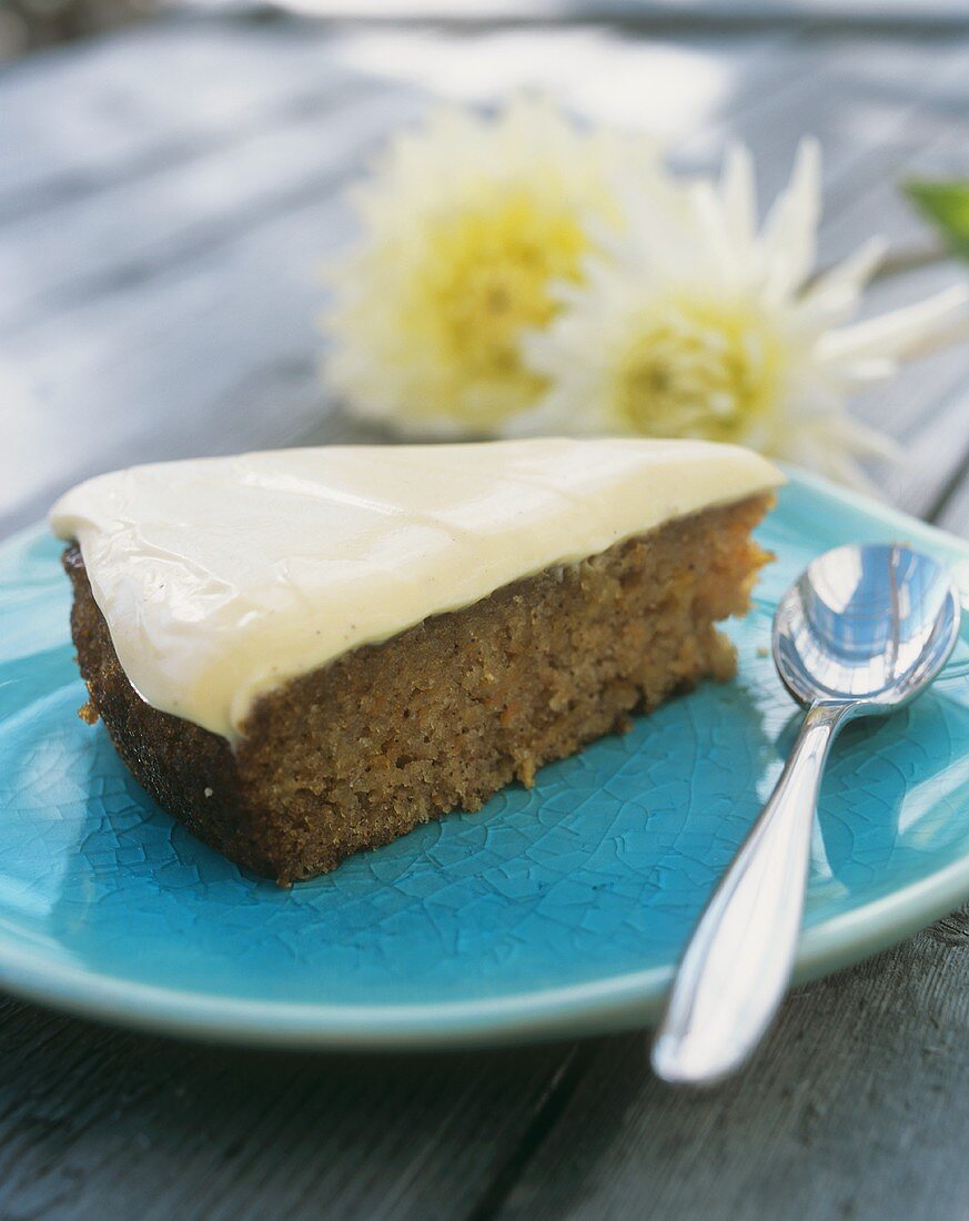 A piece of apple and carrot cake with vanilla quark