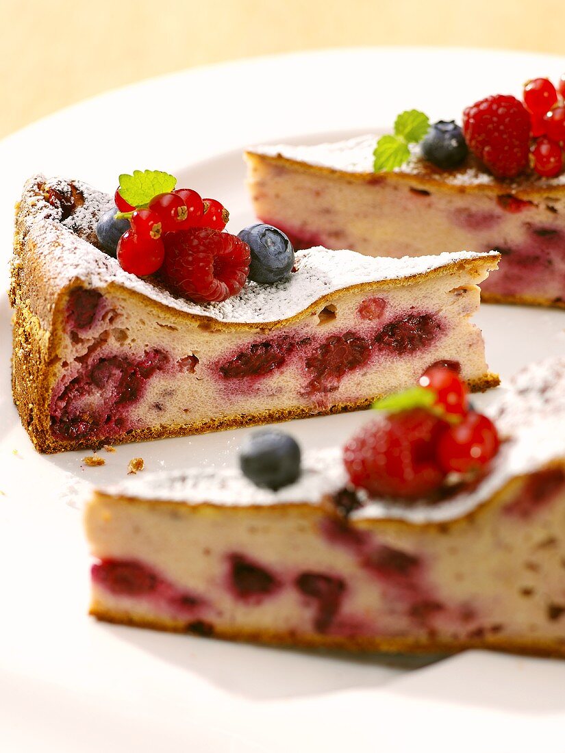 Three pieces of berry cheesecake