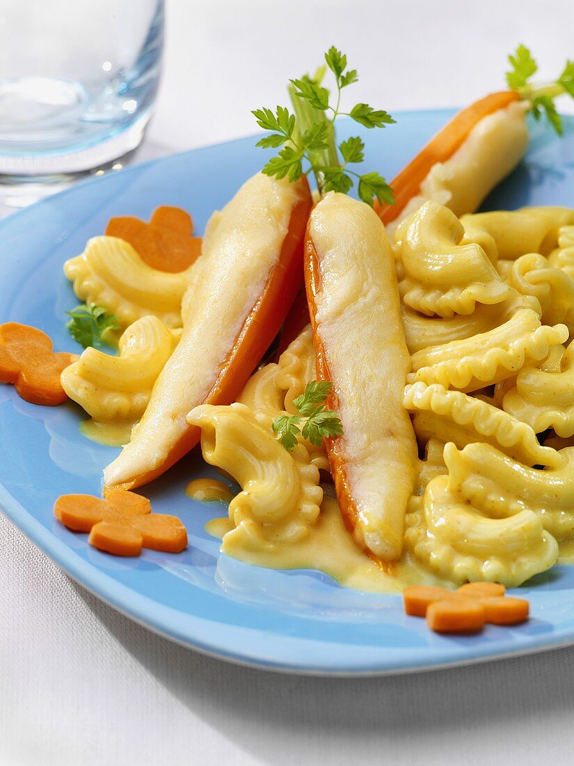 Pasta in mild curry sauce with cheesy carrots