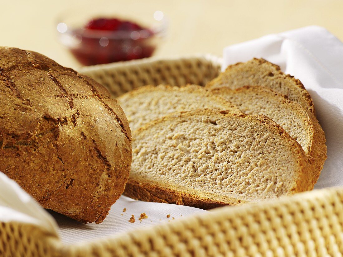 Mixed rye and wheat bread, partly sliced, in bread basket