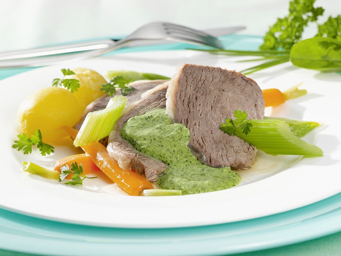 Boiled beef with vegetables and green (herb) sauce