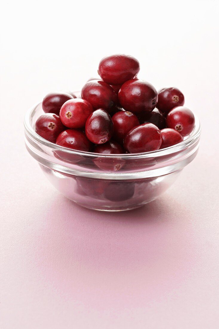 Fresh cranberries in a small glass dish