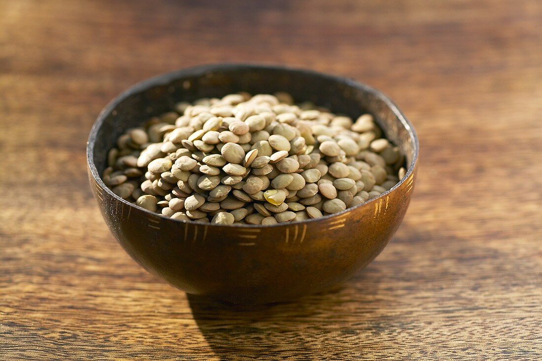Green lentils in a small bowl