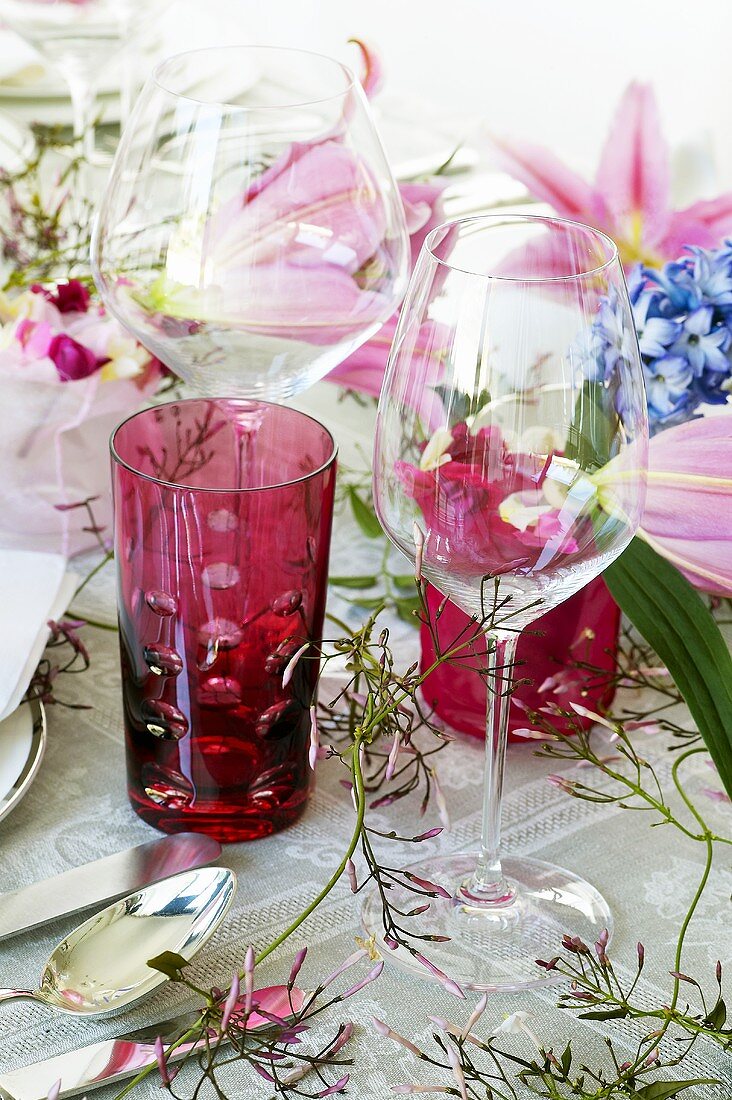 Glasses on festive table with floral decorations