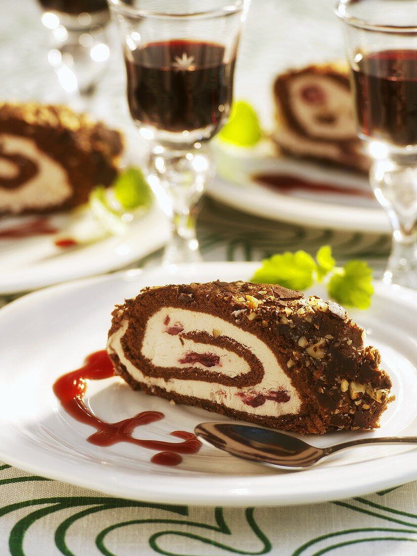 Cream-filled chocolate roll with red fruit sauce