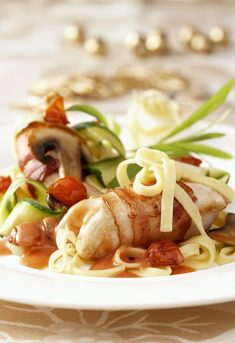Chicken breast wrapped in bacon with ribbon pasta & vegetables