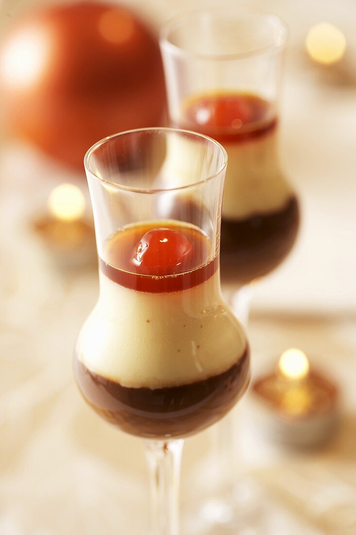Layered chocolate & vanilla dessert with liqueur cherries