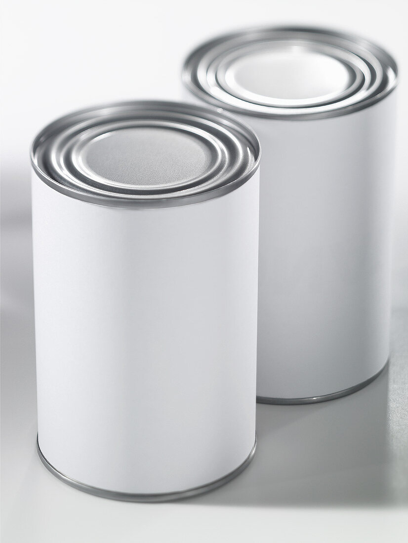 Two food tins with plain labels