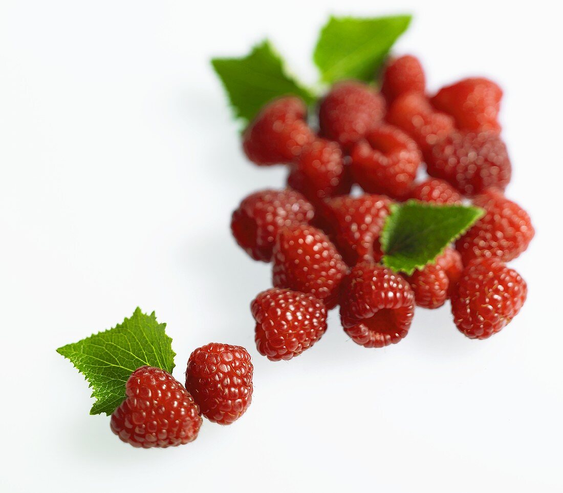 Fresh raspberries with leaves