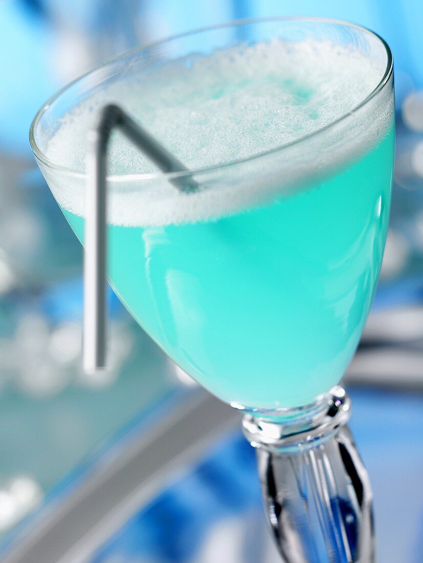 Blue cocktail with straw