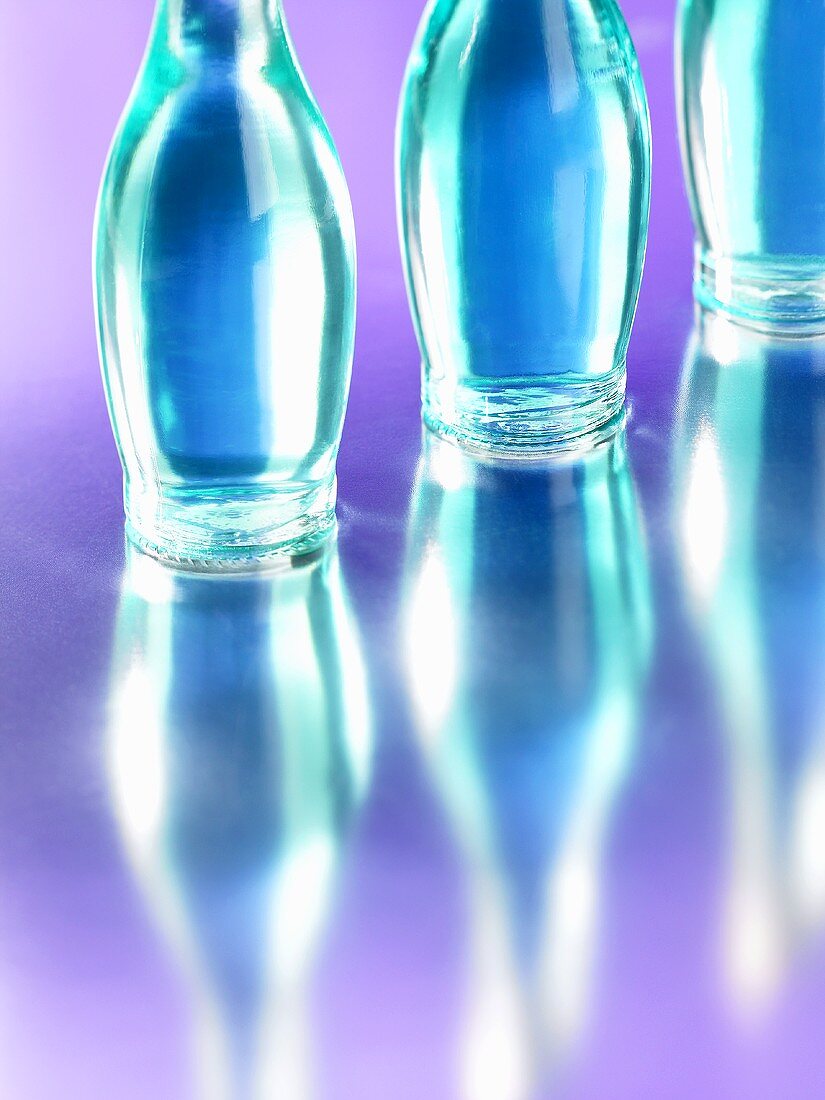 Three blue bottles