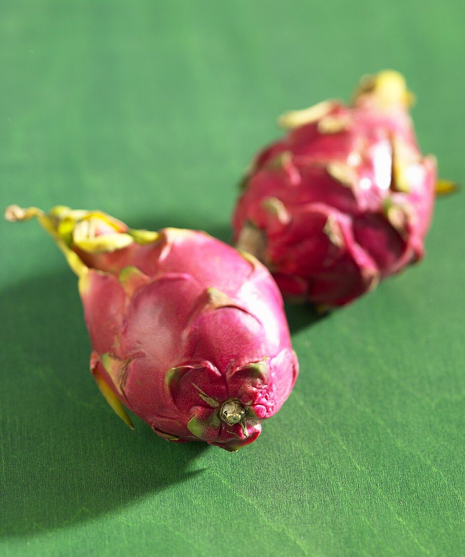 Two pitahayas (dragon fruit)