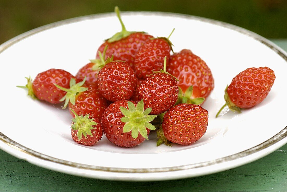 Fresh strawberries on white plate