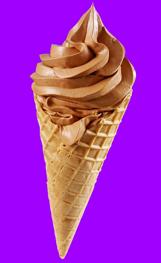 A cone of soft chocolate ice cream