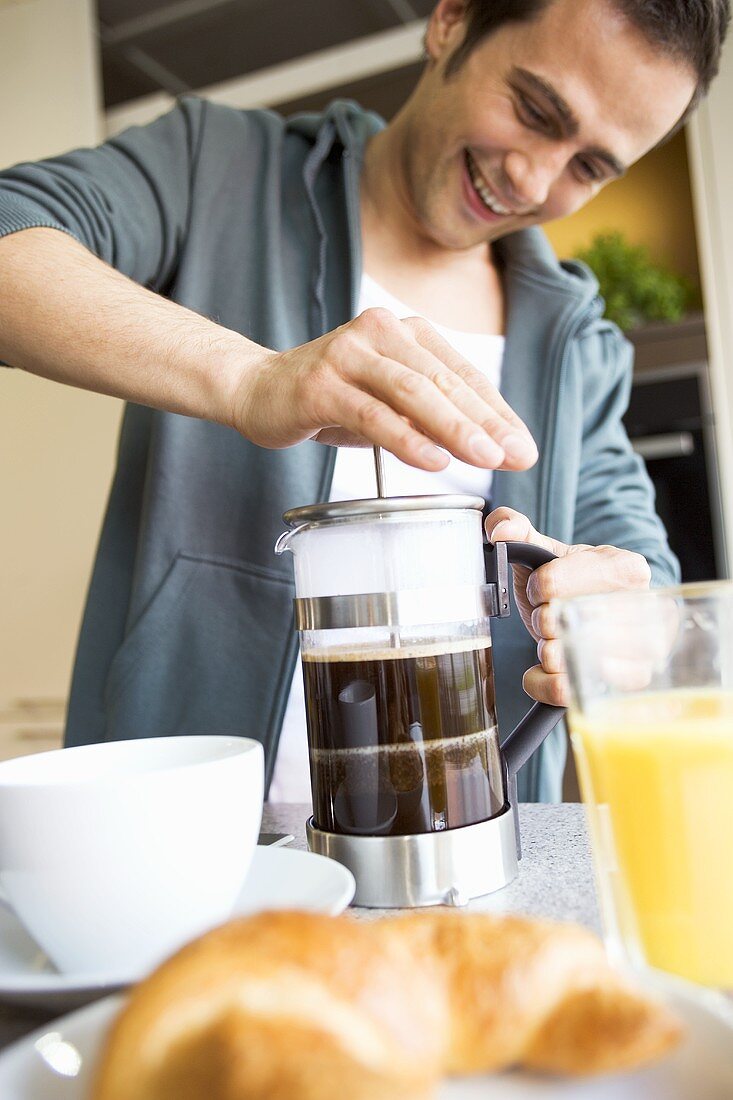Man making coffee in a cafetière