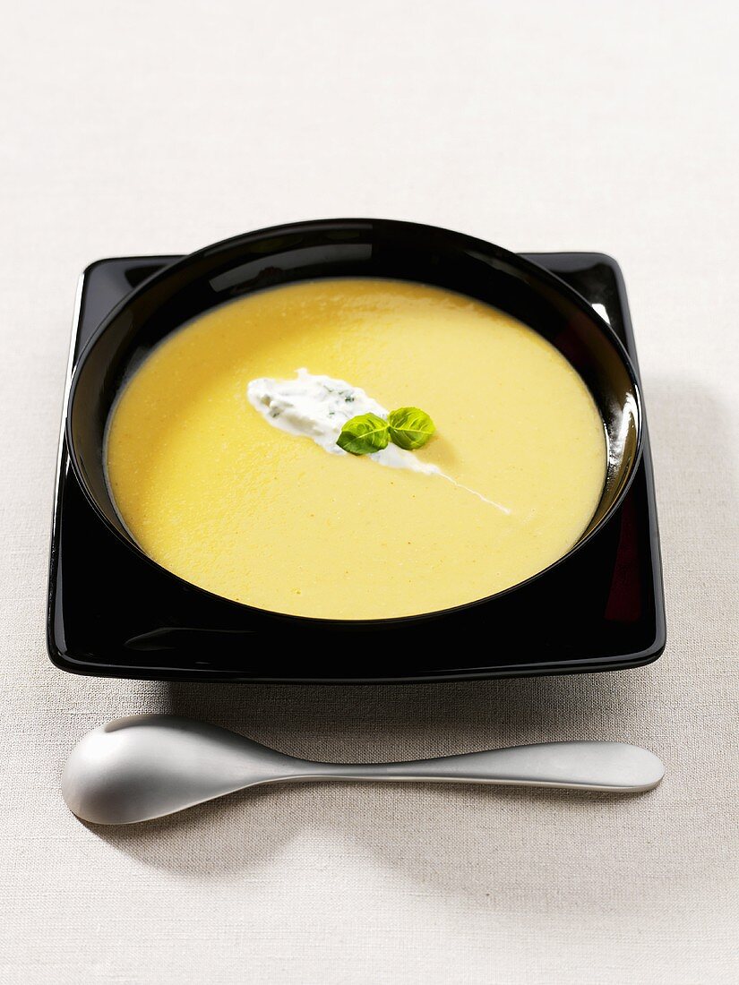 Vegetable cream soup with herb soft cheese