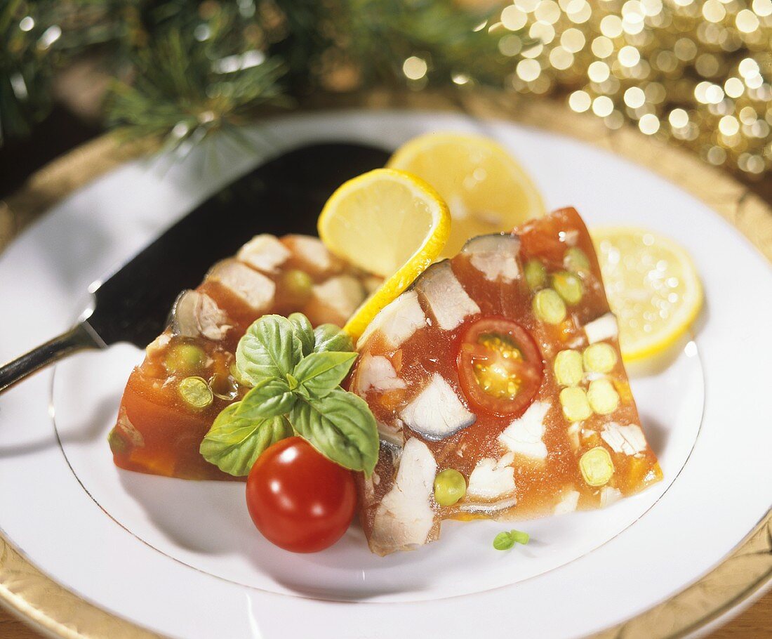 Christmas carp in jelly with tomatoes and peas