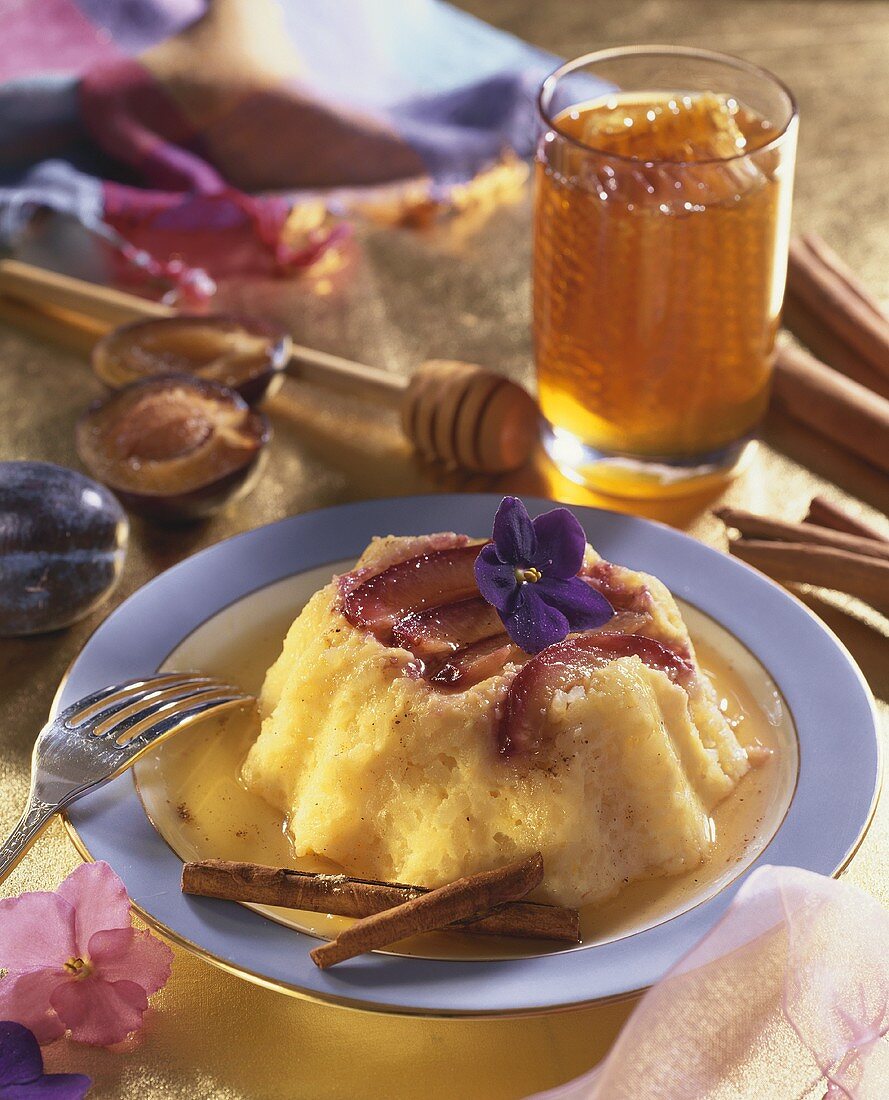 Rice pudding with plums and honey sauce
