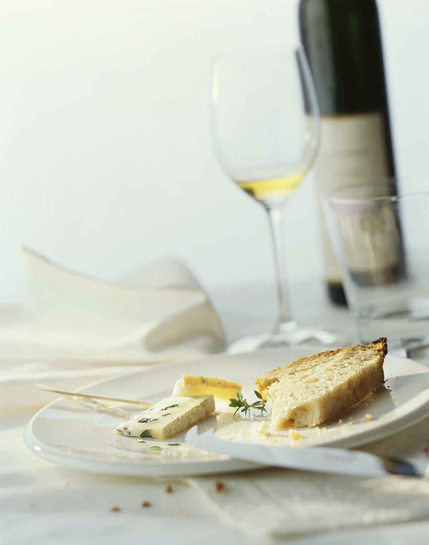 Remains of bread and cheese on plate