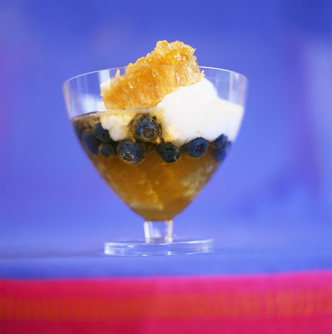 Orange jelly with blueberries and quark cream