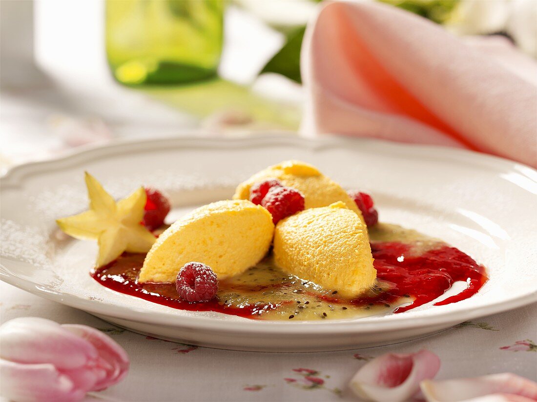 Spooned-out saffron cream with fruit puree