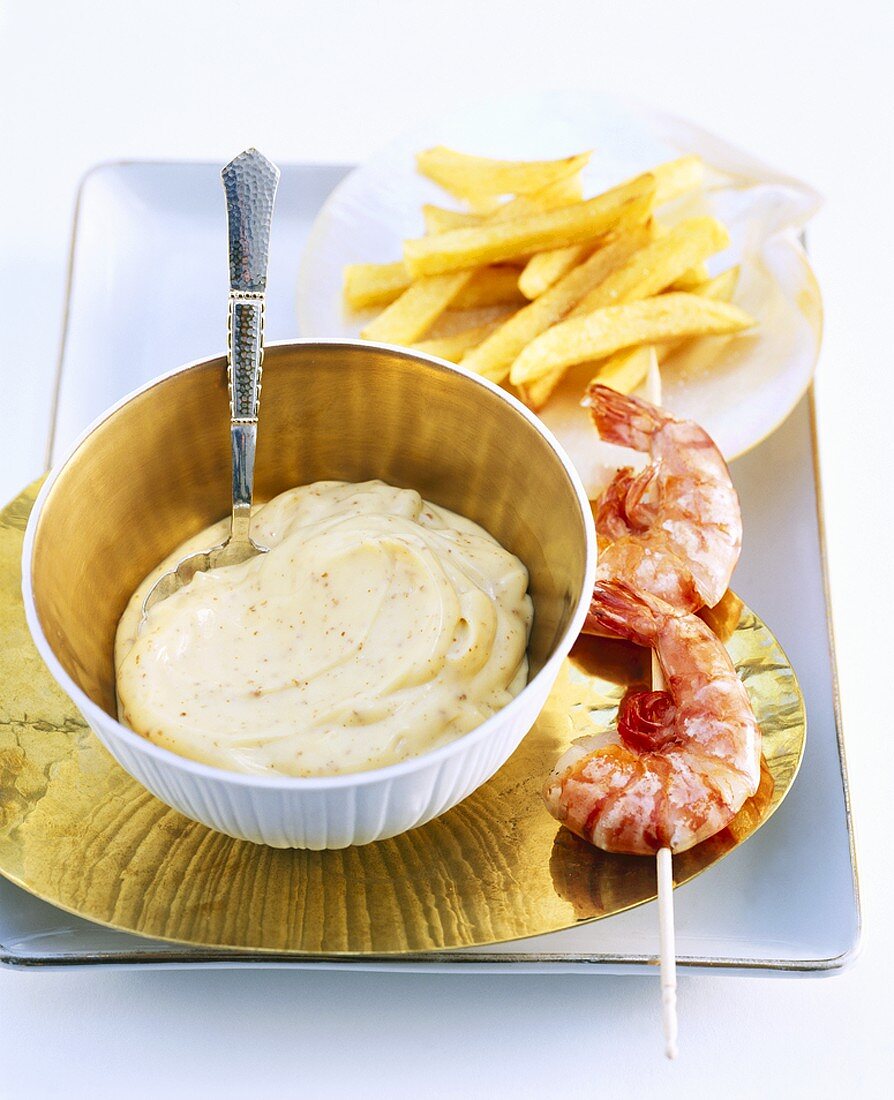 Skewered prawns and chips with mustard mayonnaise