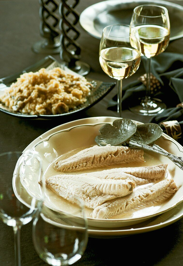 Poached fish fillets with mushroom risotto