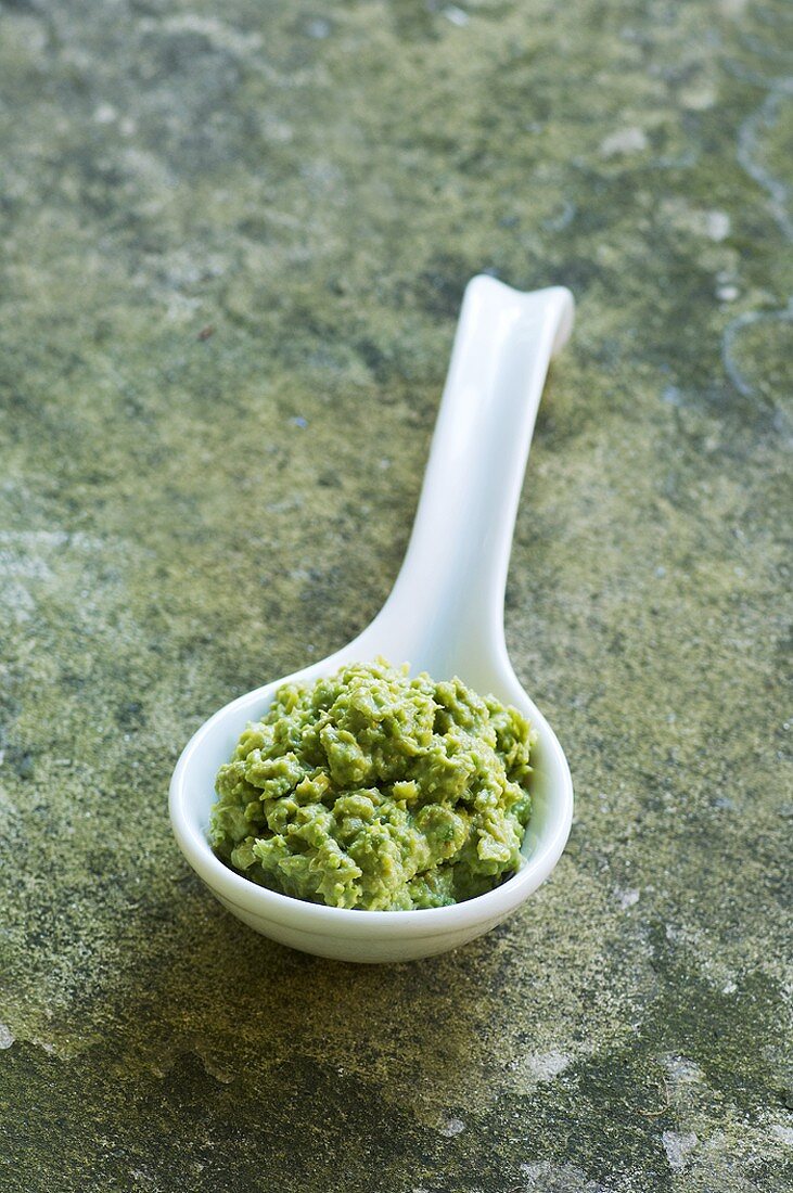 Pea puree in a spoon