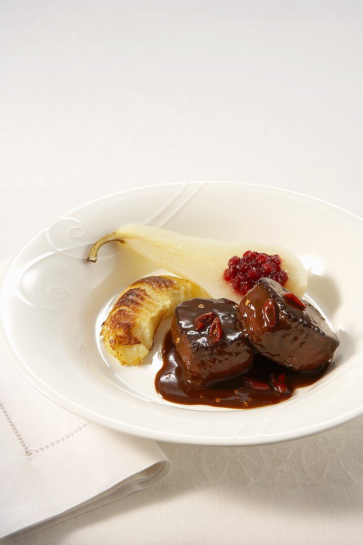 Venison medallions in red wine, chocolate and chilli sauce