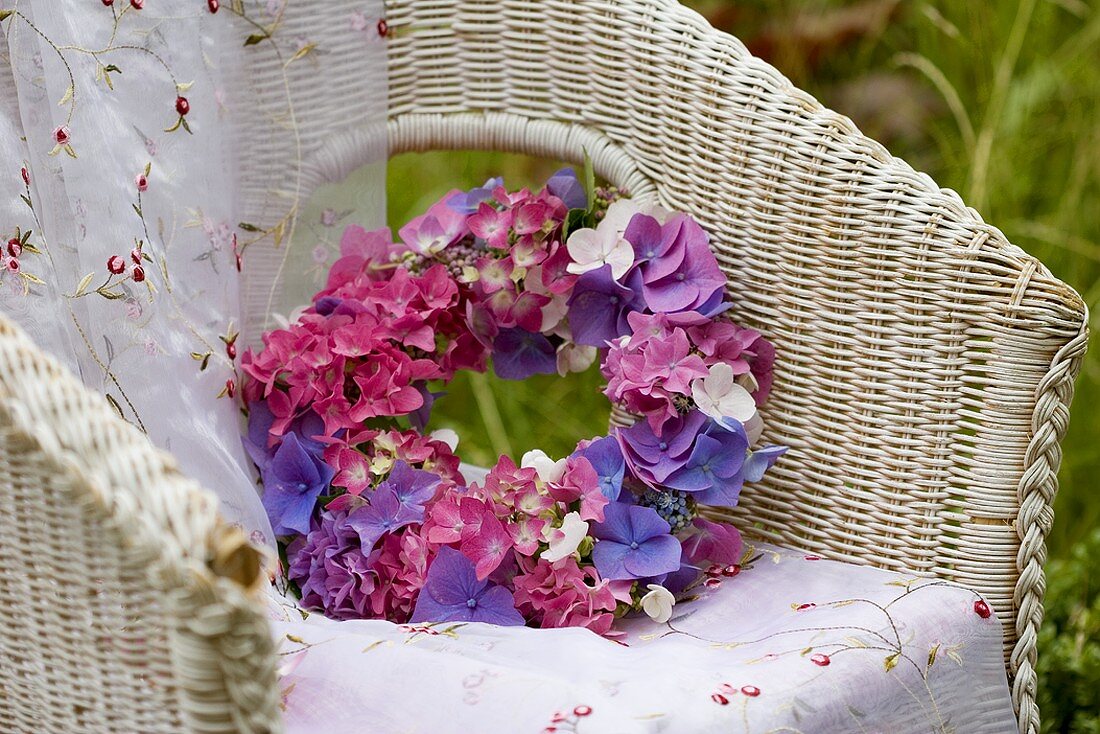 Hydrangea wreath in wicker chair