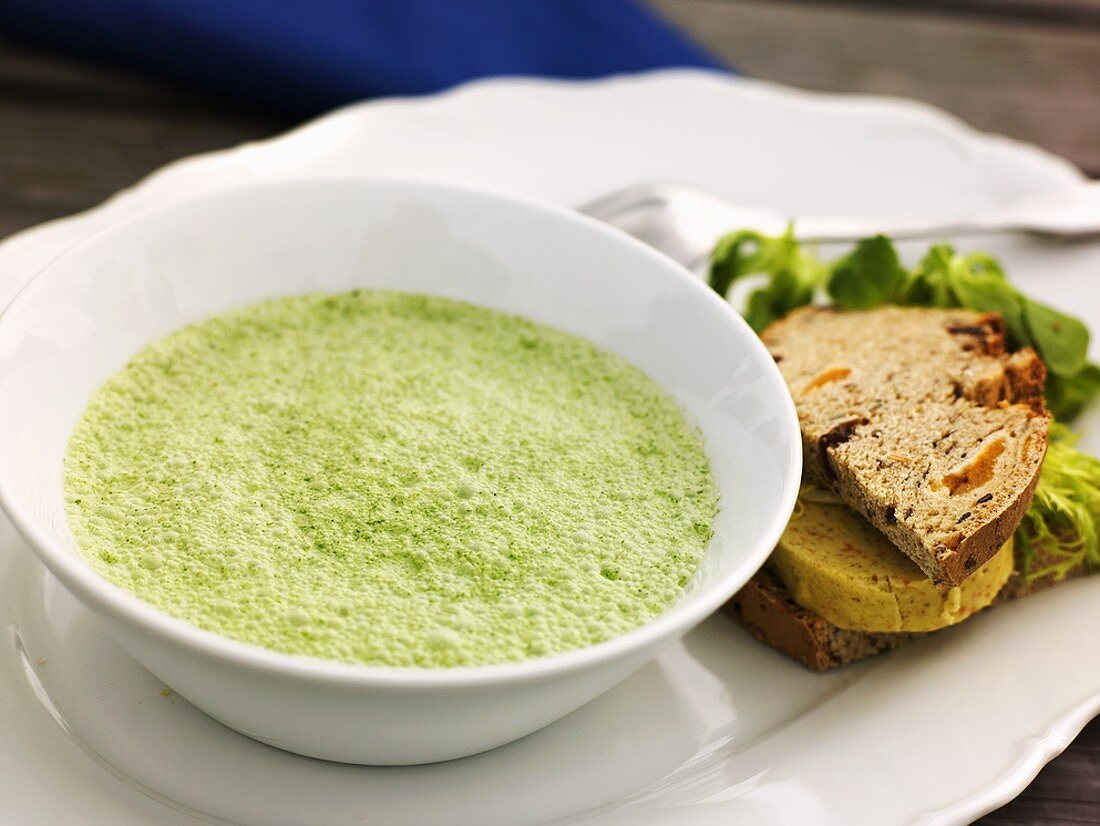 Herb foam soup with savoury bread